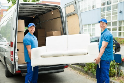 Movers preparing a Windsor home relocation with packed boxes
