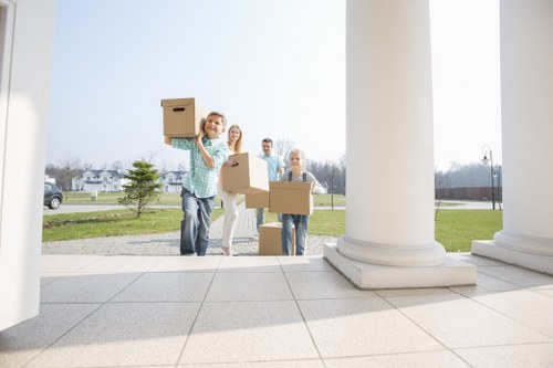 Local team collecting sofas, beds, and wardrobes from a Windsor property