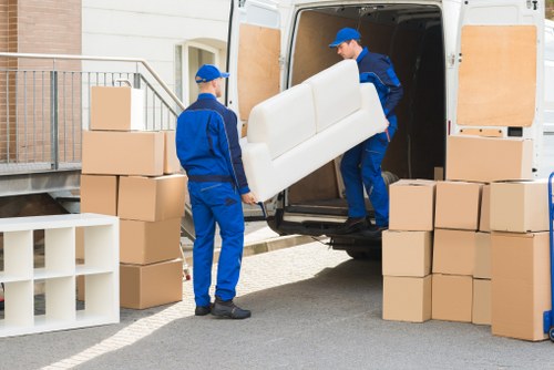 Removal van and moving boxes near a Windsor home