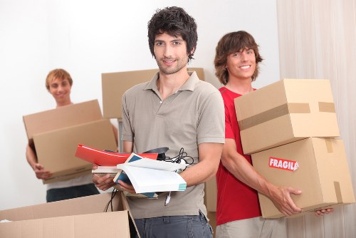 Packed moving boxes and furniture prepared for transport