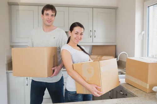 Professional movers handling household items in Windsor